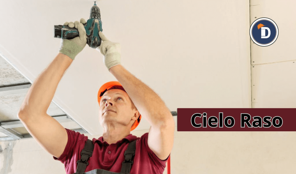 "Trabajador instalando drywall en un cielorraso de construcción"